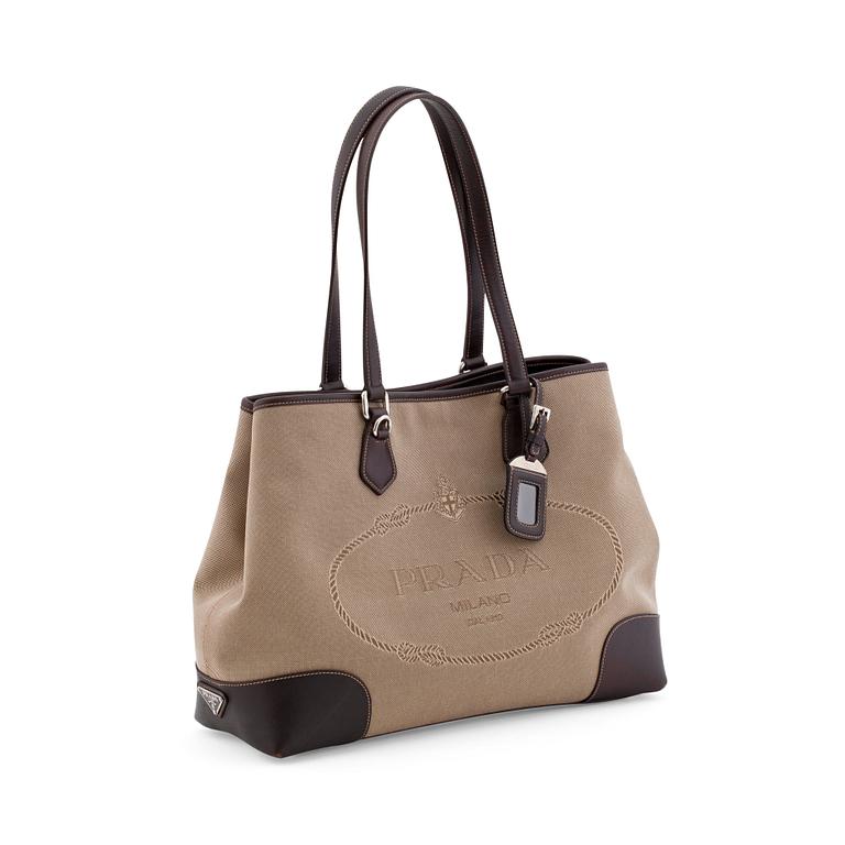 PRADA, a brown canvas and leather shoulderbag.