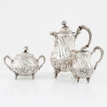 A Spanish Silver Rococo-Style Coffee Pot, Creamer and Sugar Bowl, first half of the 20th Century.