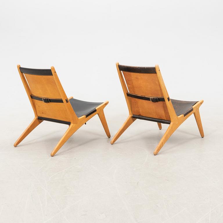 Östen Kristiansson armchairs, a pair of "Jaktstol/Vilstol 204" Luxus, Vittsjö, second half of the 20th century.