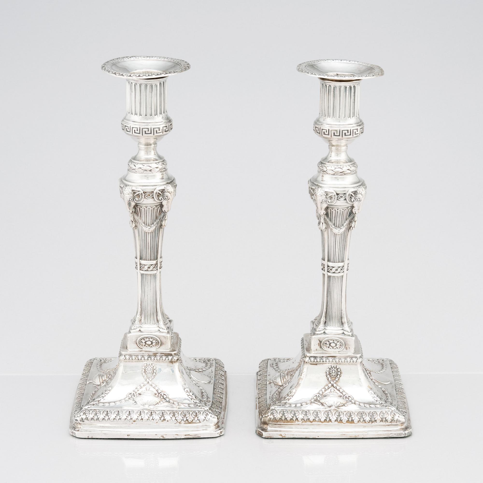An English pair of 18th Century silver candlesticks, mark of John Winter & Co, Sheffield 1775.