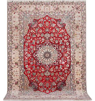 A signed Esfahan carpet, part silk, c. 298 x 206 cm.