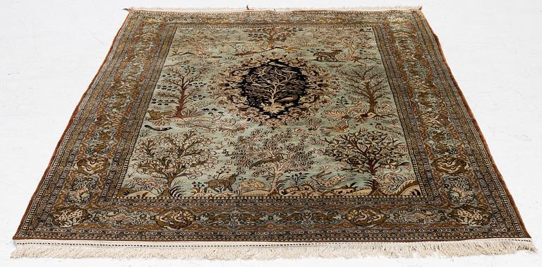A Ghom, figural, silk rug, c. 205 x 140 cm.