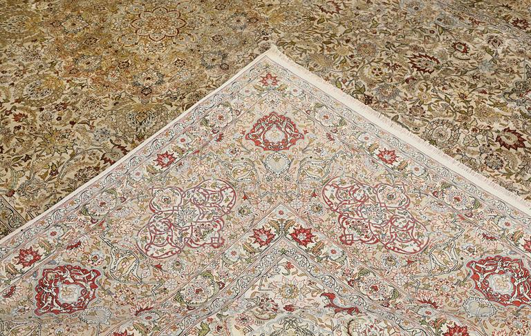 A oriental silk carpet, 350 x 247 cm.