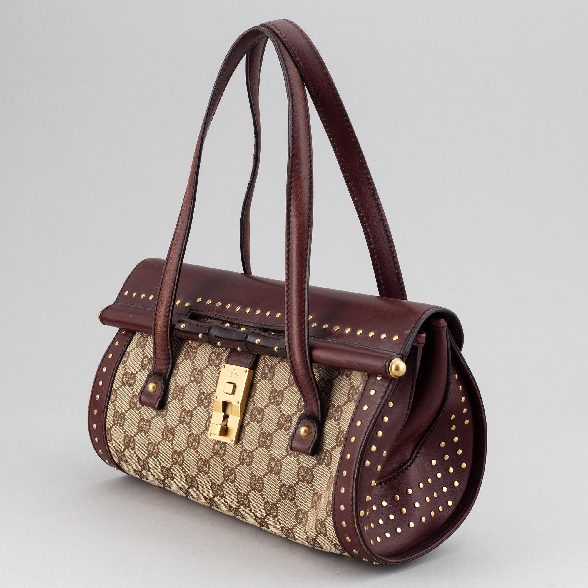 Gucci, a monogram canvas bag.