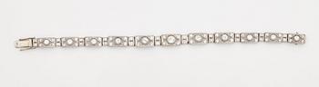 A bracelet set with old and eight cut diamonds.