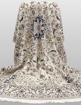 A Nain carpet, part silk, so-called 9 LAA, approx. 355 x 248 cm.