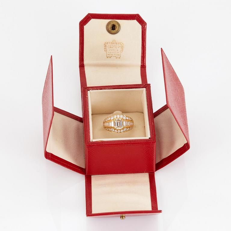 A RING set with an emerald-cut diamond.