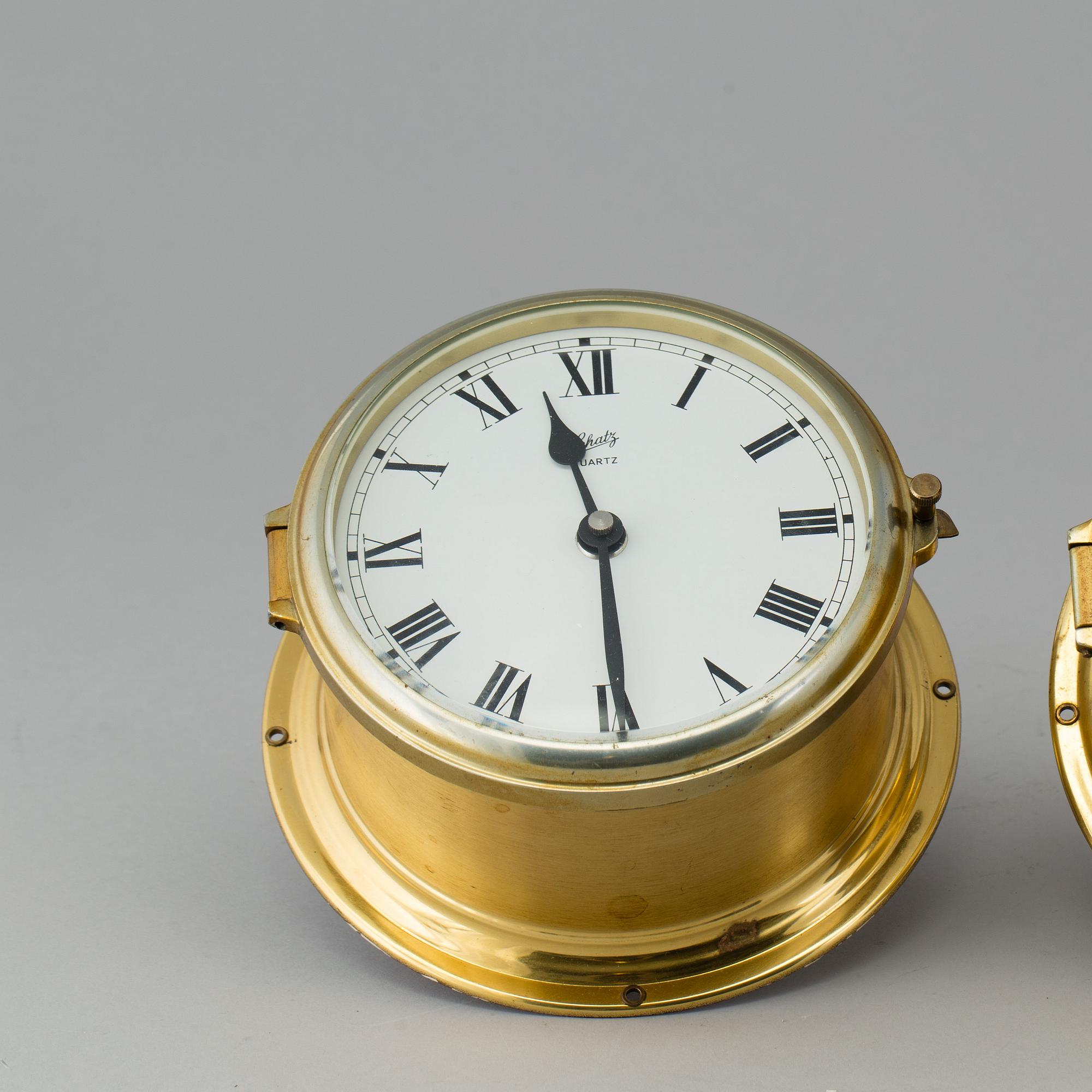 A brass barometer and clock, Schatz, 20th century.