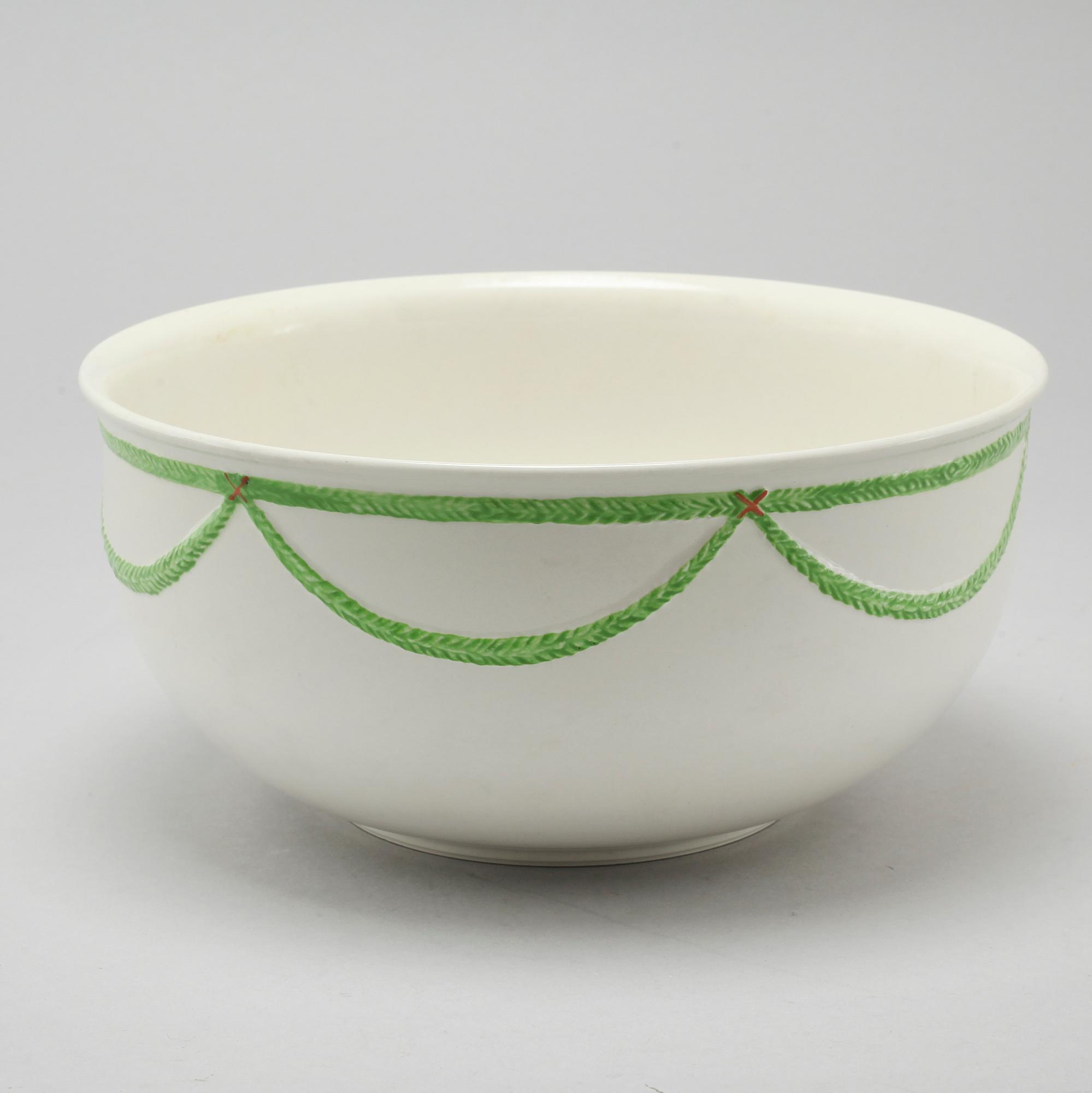 A 20th century set of earthenware tableware of 21 pcs by Gustavsberg.