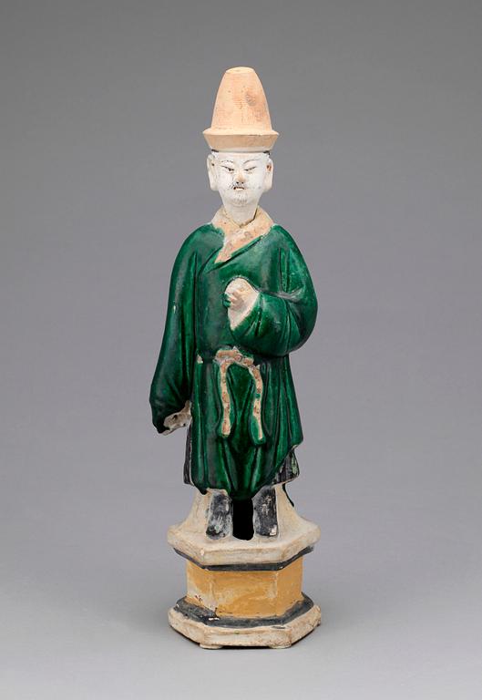 A green and yellow glazed potted figure of a Dignitary, Ming dynasty (1368-1644).