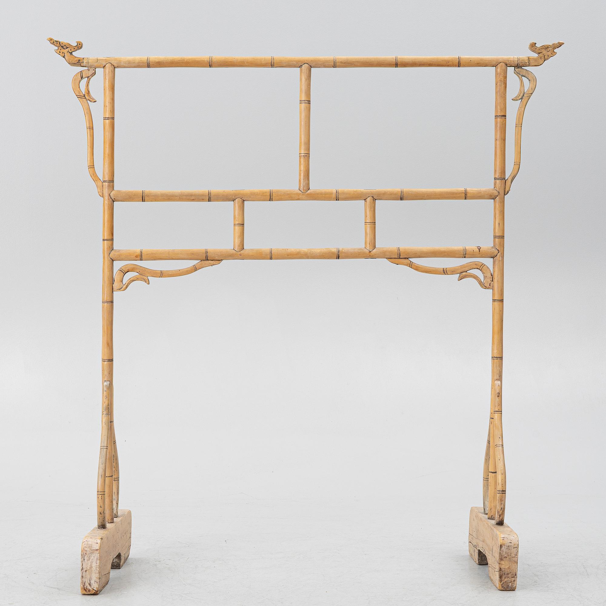 A Chinese bamboo and hardwood clothes rack, 20th century.