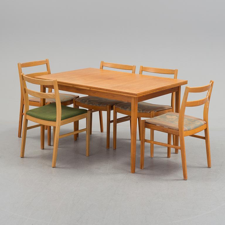 Four chairs and a dining table from the 1960s.