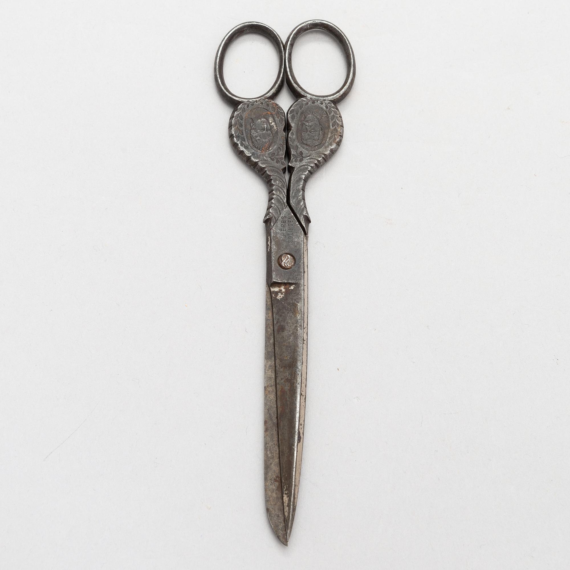 Steel scissors with the portraits of Nicholas II and Alexandra Feodorovna. Manufacturer D. Peres Solingen, Germany.