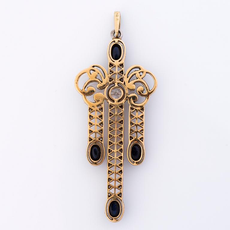 A 14K gold and platinum pendant with cabochon cut sapphires, old cut and rose cut diamonds ca. 0.6 ct in total.