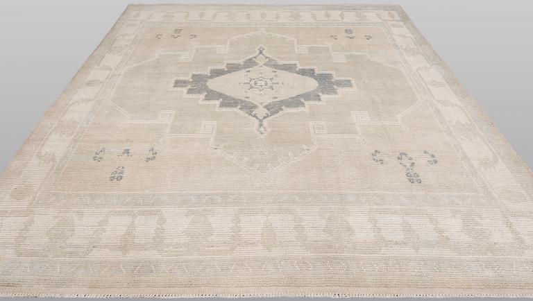 An oriental carpet, ca 312 x 256 cm.