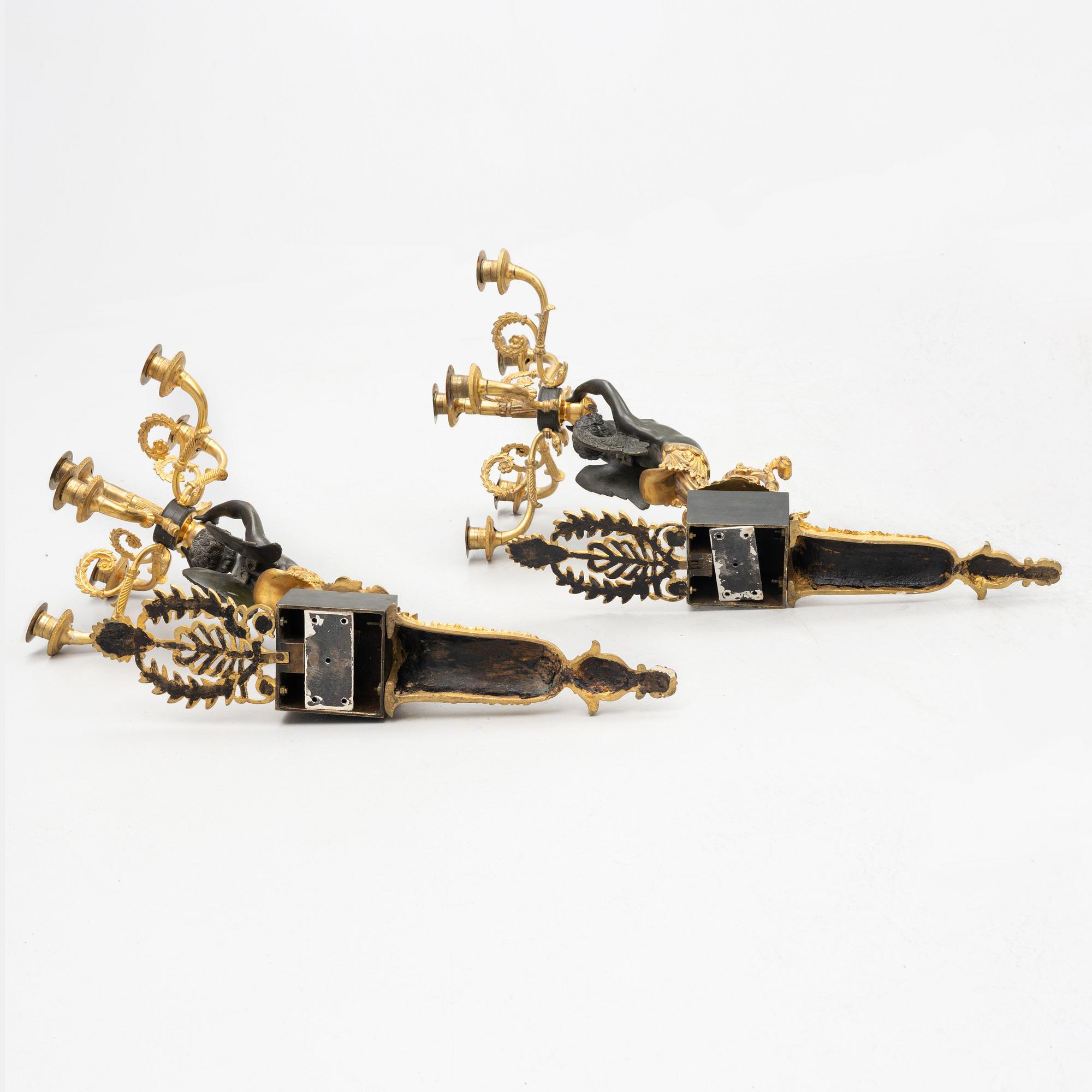 A pair of Empire style appliques, circa 1900.