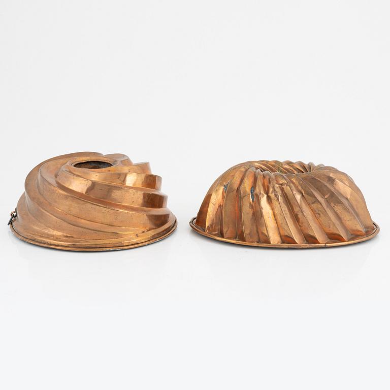 Four copper cake moulds. 18th and 19th Century.