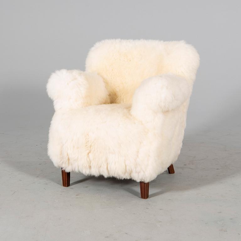 A 1940/50s cheep skin armchair.