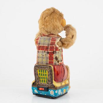 A set of five toys, including 'Rolly' clown from Schuco, 20th century.