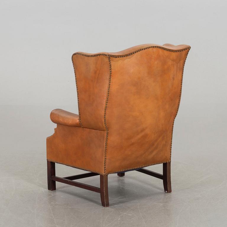 A LEATHER ARMCHAIR, second half of 20th century.