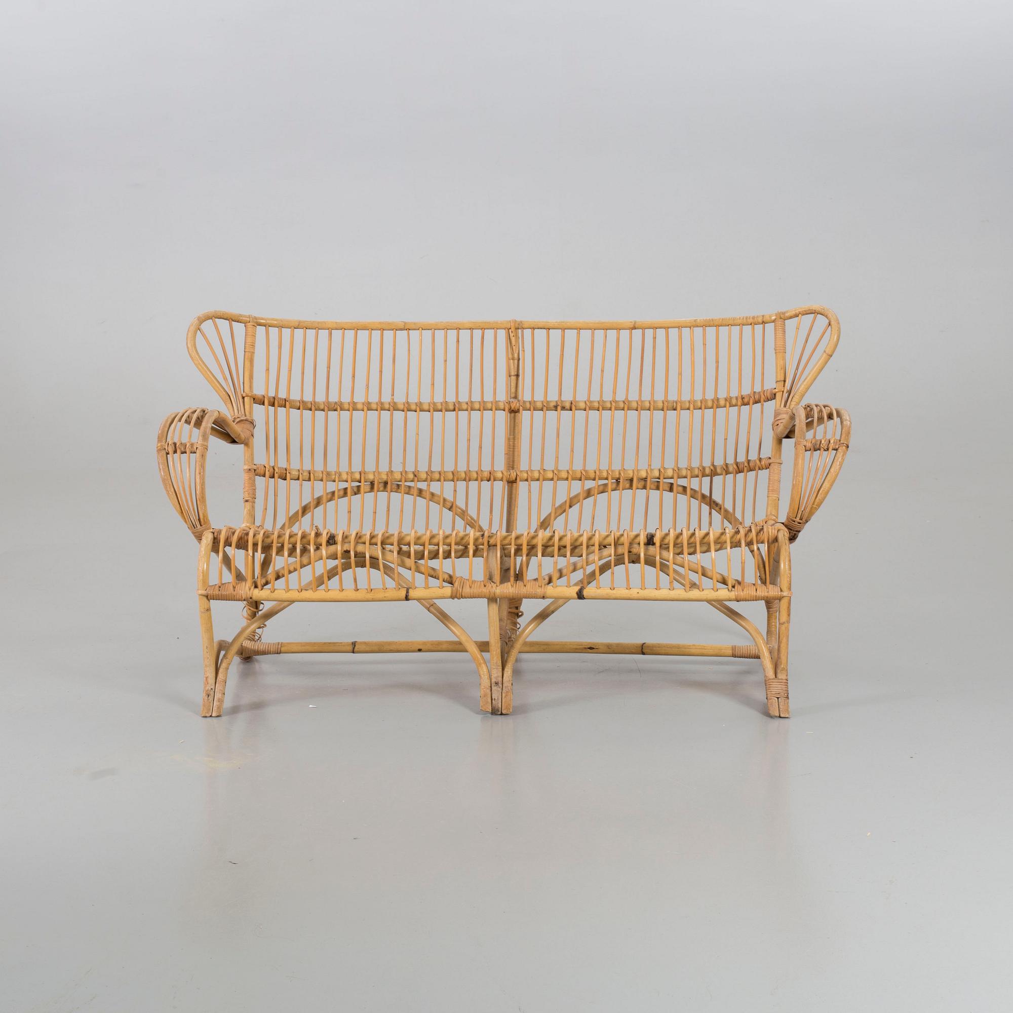 A mid 20th century ratten couch.