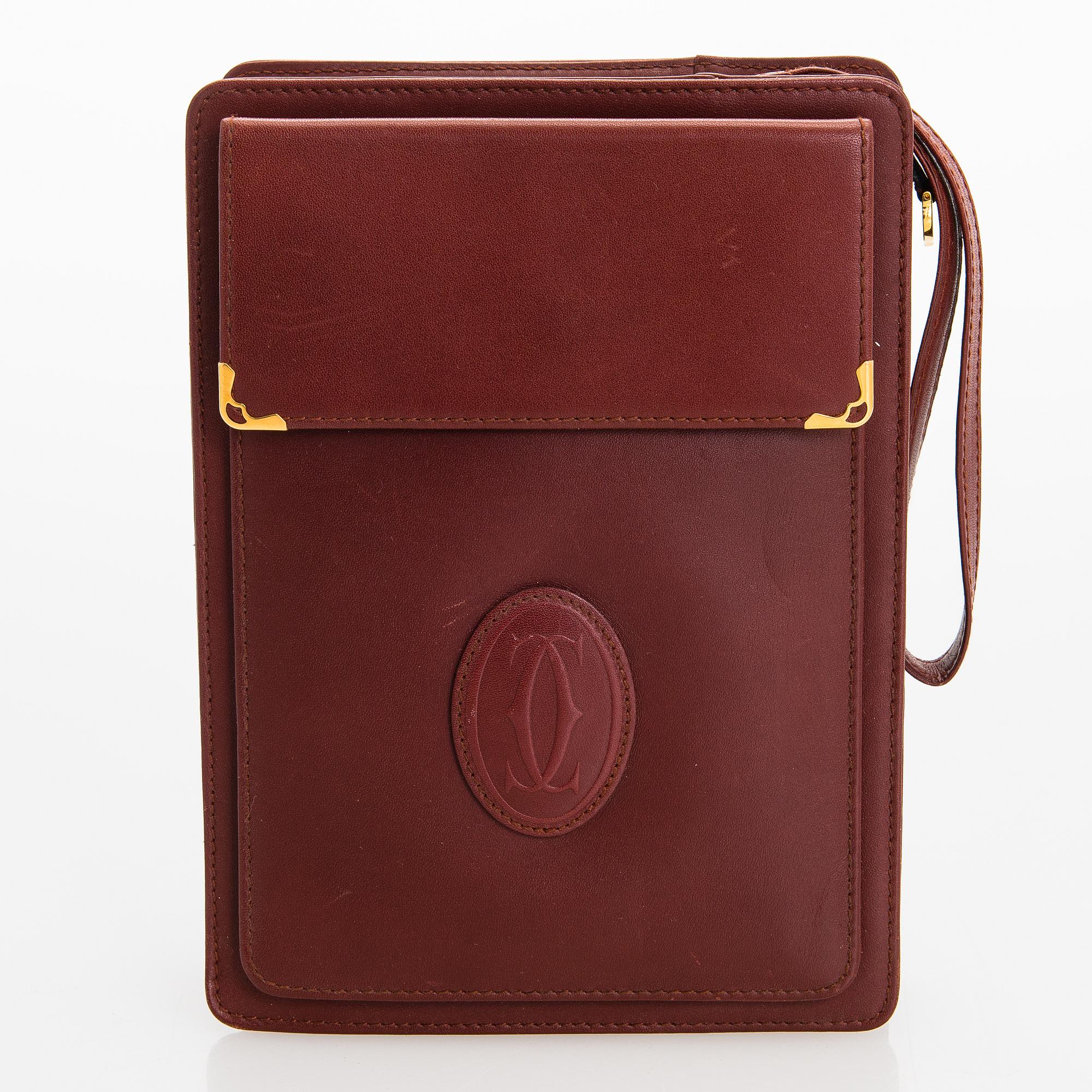 Must de Cartier bag clutch with accessories.