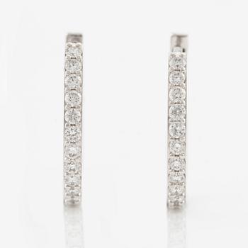 A pair of earrings in 18K white gold with round brilliant-cut diamonds.