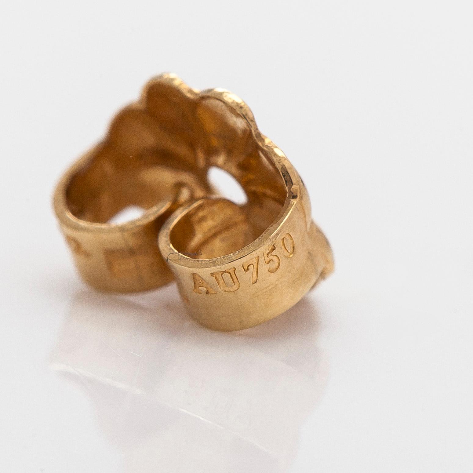 Tiffany & Co, Paloma Picasso, "Melody" hoop earrings in 18K gold.