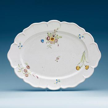 717. A Swedish Rörstrand faience charger, dated 11/1 (17)73.