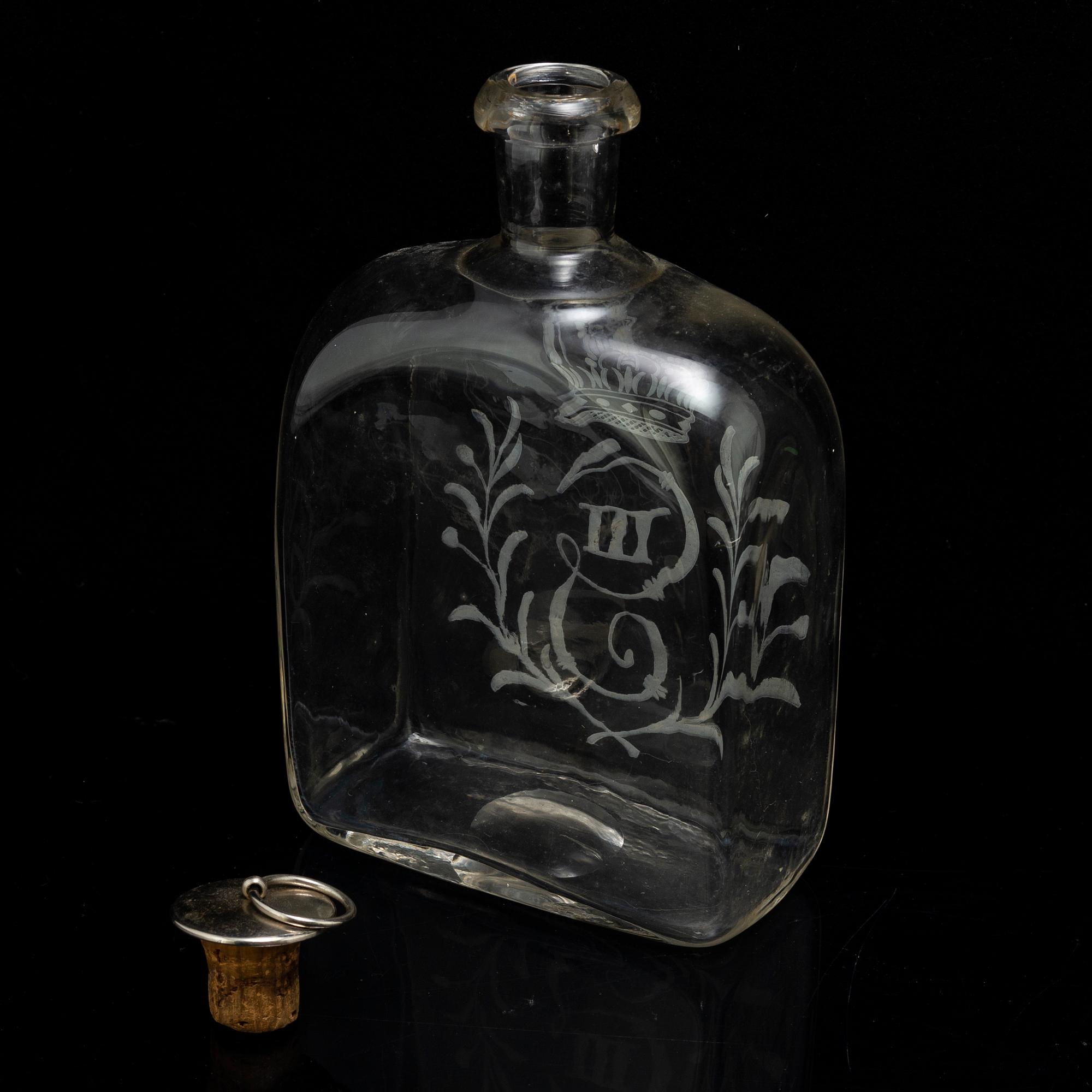 A set of five snapps glasses and a snapps bottle, with Gustav III crowned monogram. 20th century, Baroque-style.
