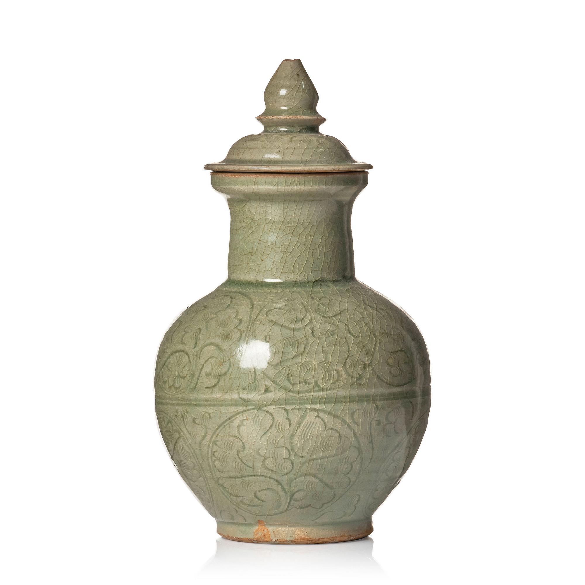 A celadon glazed jar with cover, Yuan dynasty (1271-1368).