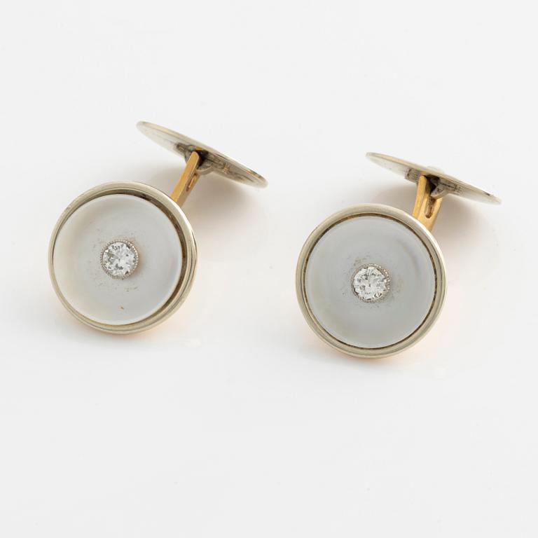 Cufflinks with mother-of-pearl and brilliant-cut diamonds.