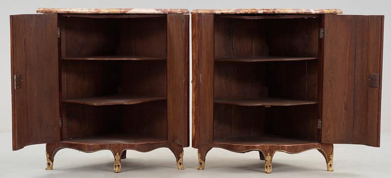 A pair of Louis XV 18th century corner cabinets by F. Reizell.