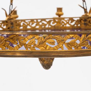 A gilt bronze sixteen-light Empire-style chandelier, later part of the 19th century.