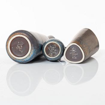 Carl-Harry Stålhane and Gunnar Nylund, two stoneware pitchers jugs and a vase, Rörstrand.