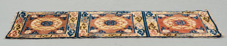 A MEDITATION RUG, a semi-antique Ningxia, China, ca 164,5 x 57,5-58,5 cm.