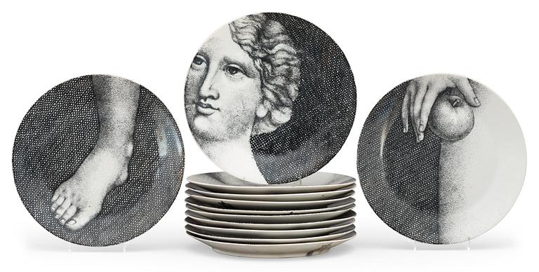 A Piero Fornasetti set of twelve 'Eva' porcelain plates, Milano, Italy.