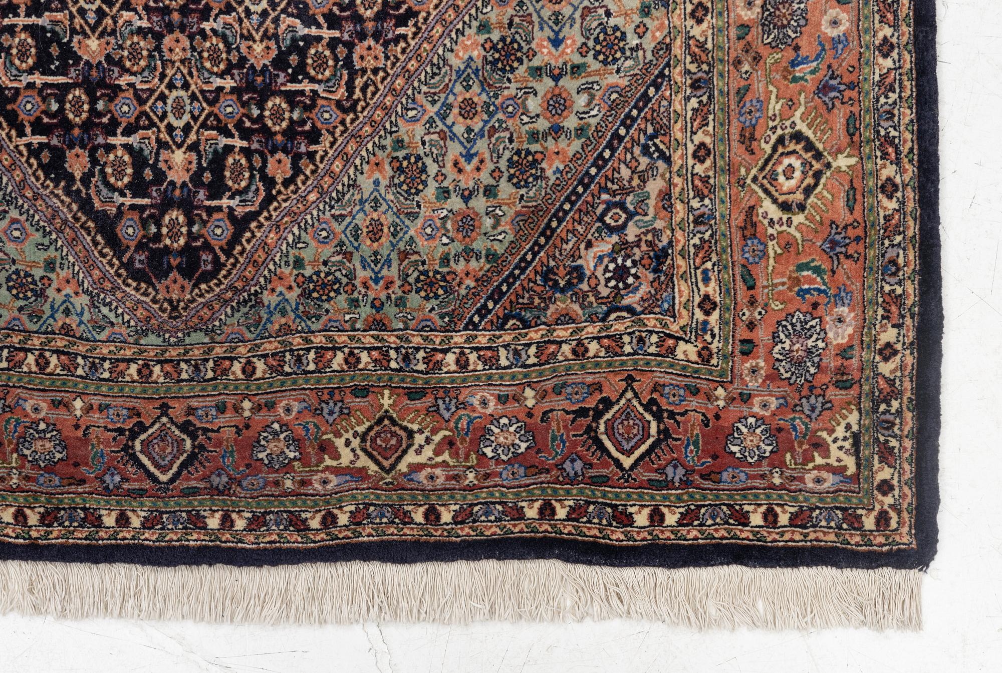 An oriental rug, approx. 203 x 135 cm.