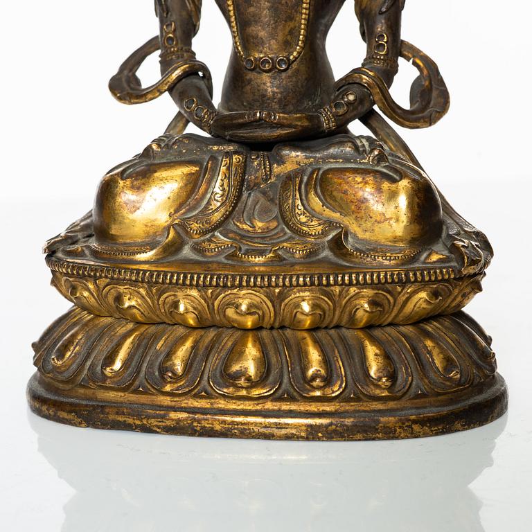 A gilt copper figure of Amitayus, Tibeto-Chinese, 18th Century.