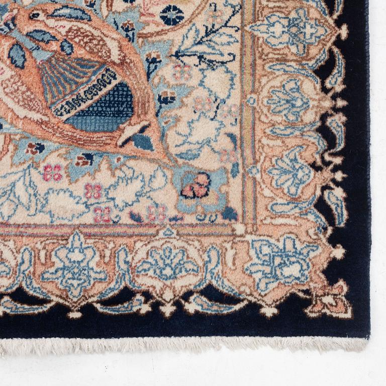 An oriental carpet, circa 390 x 302 cm.
