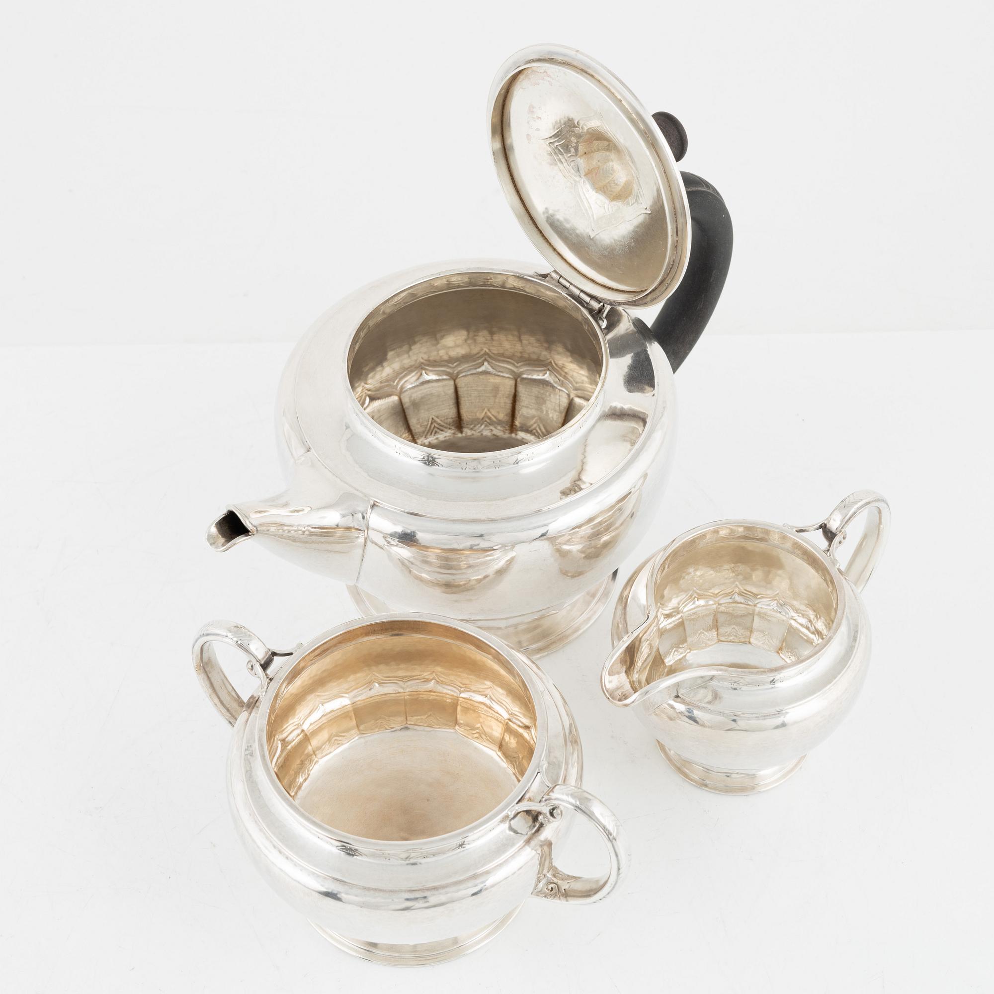 A Norwegian Silver Teapot, Sugar Bowl and Creamer, mark of David Andersen, Oslo circa 1923.