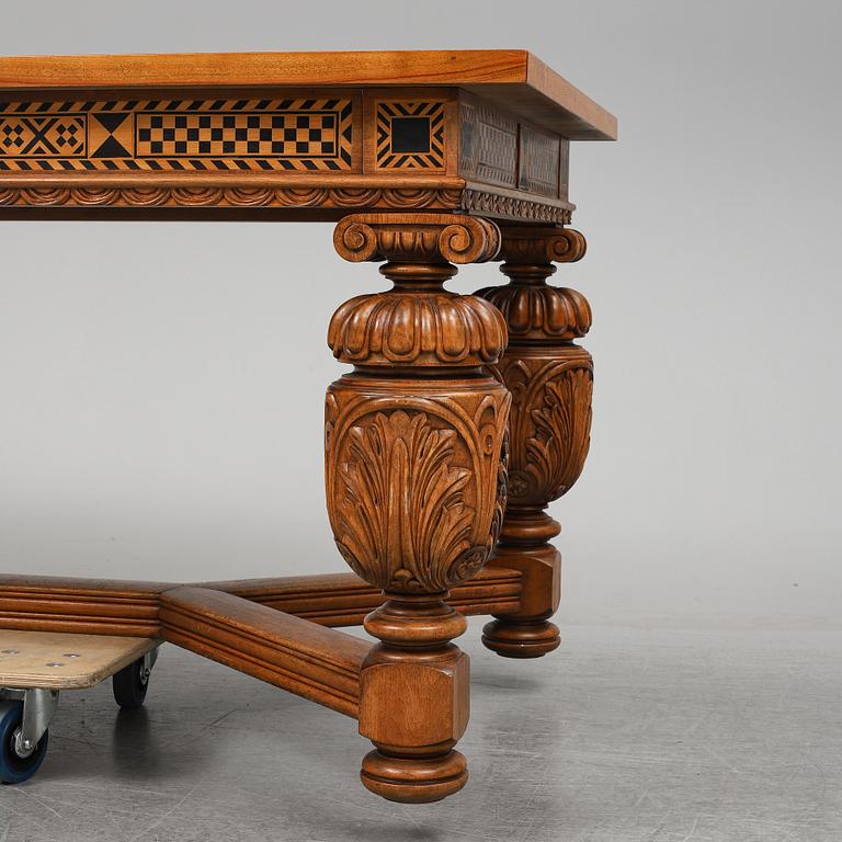 A 20th century baroque-style mahogany table.