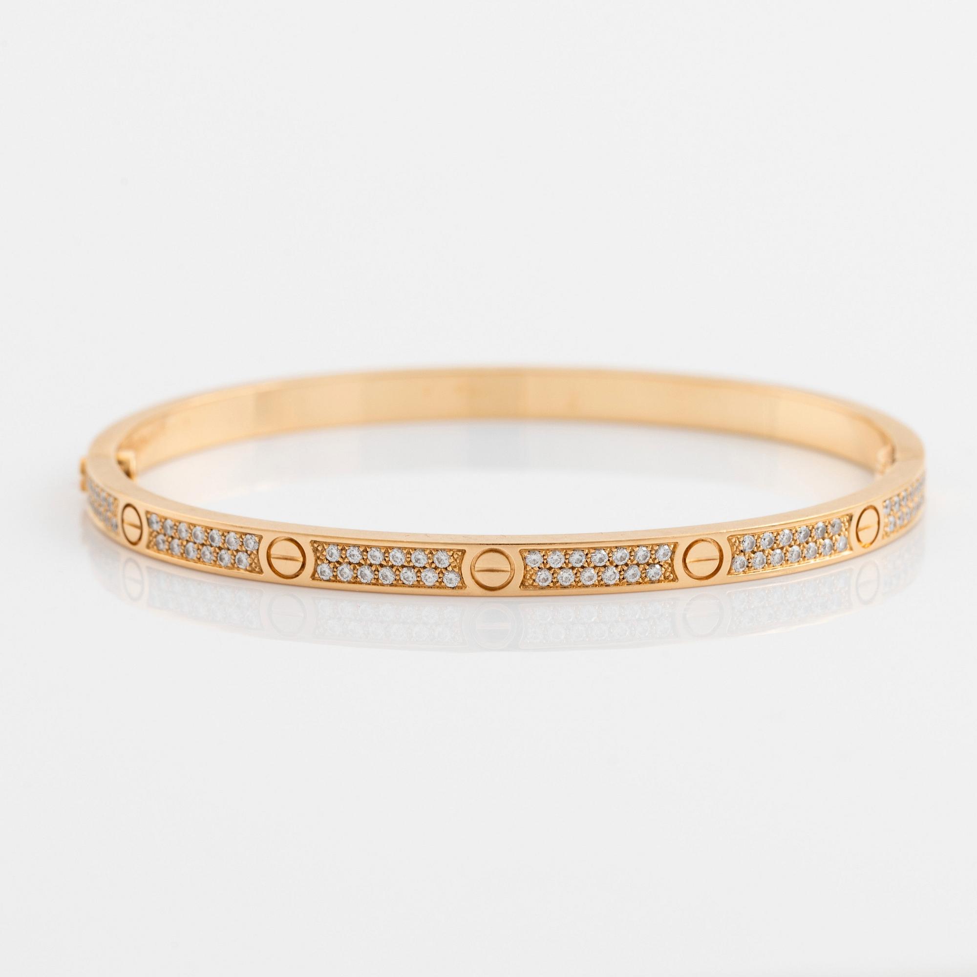 A Cartier Love bracelet small model in 18K gold set with round brilliant cut diamonds. size 16 total weight 17 g. Signed Cartier numbered DOT70. Bukowskis