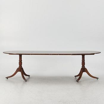 A dining table, 20th century, England.