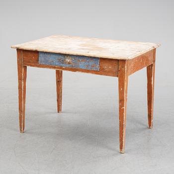 A 19/20th Century table with a drawer.