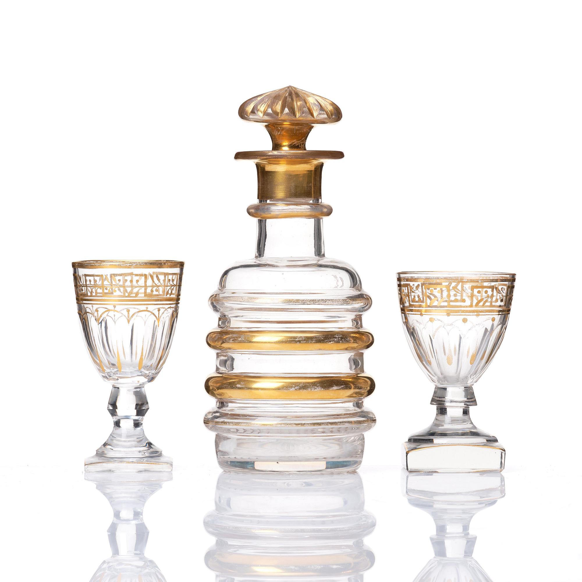 A set of Russian glasses (13 pcs.) and a bottle with stopper, 19th Century.