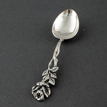 22 swedish silver spoons and one ladle, from the 19th and 20th century.