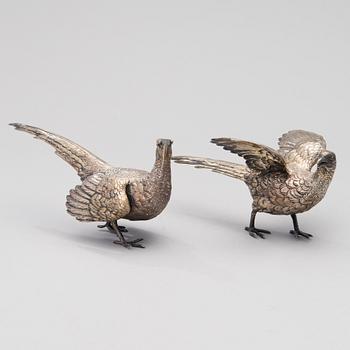 Two bird table decorations in silver, German and British hallmarks.