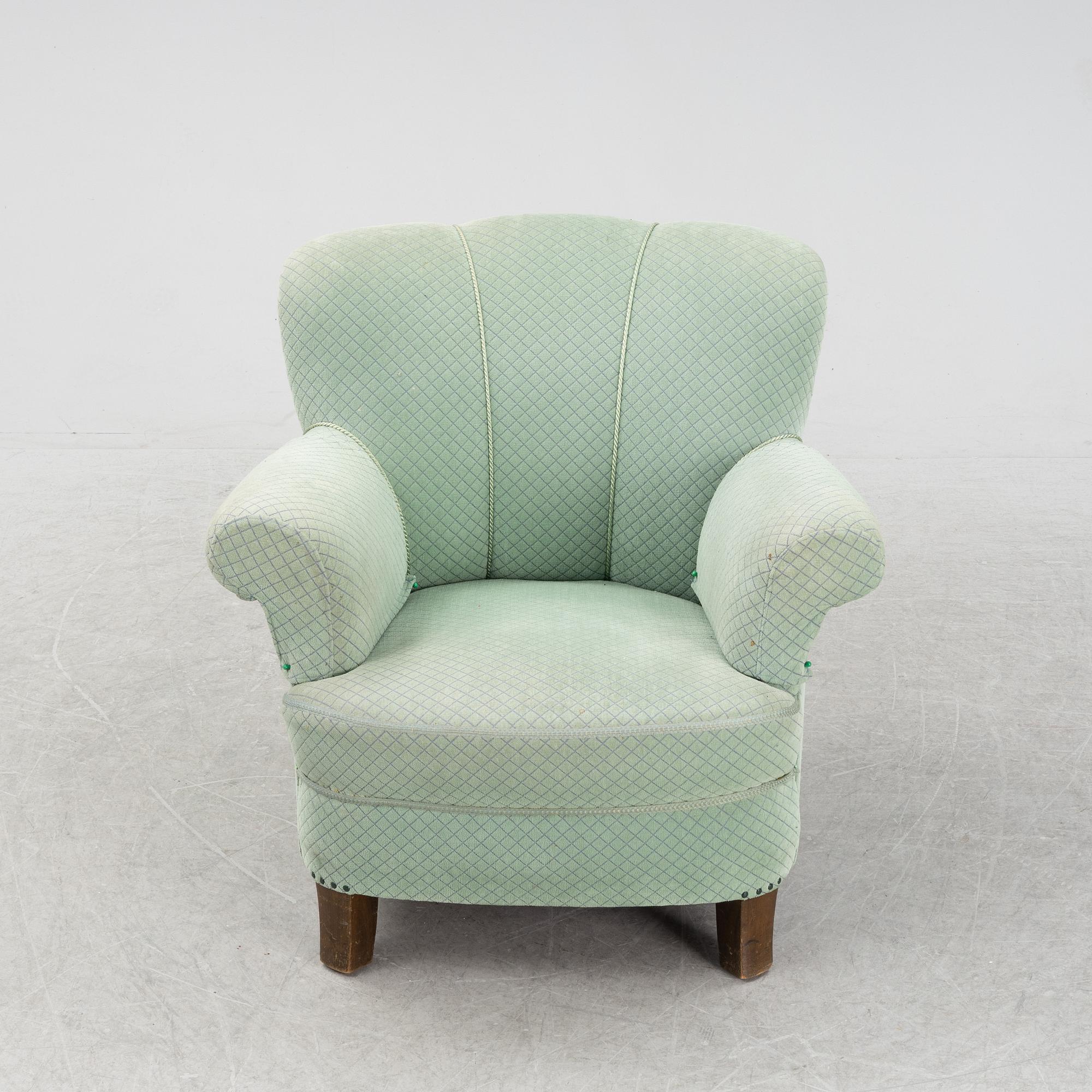 A mid 20th Century sofa and easy chair.