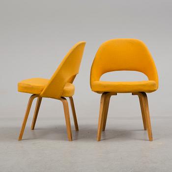 A group eight of Eero Saarinen executive side chair with wood legs, Knoll Products inc.